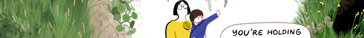 A mother holds a child in her arms, and the child waves his hand.